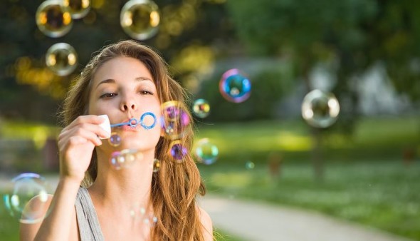 blowing soap bubbles