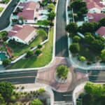 Drone shot looking forward in a suburb.